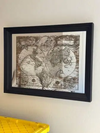 Unique picture of a world map, superimposed on a mirror