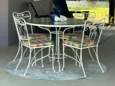 Metal and glass dining set - table and four chairs - at beach house/Gulf Shores