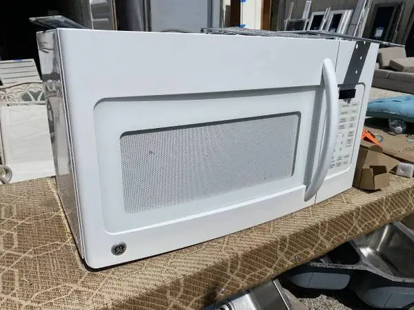 White GE Microwave Oven Over the Range Model #JVM1740DP2WW Used