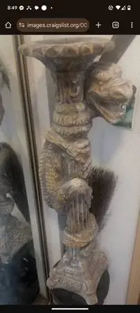 2 matching stone dragon candlestick holders