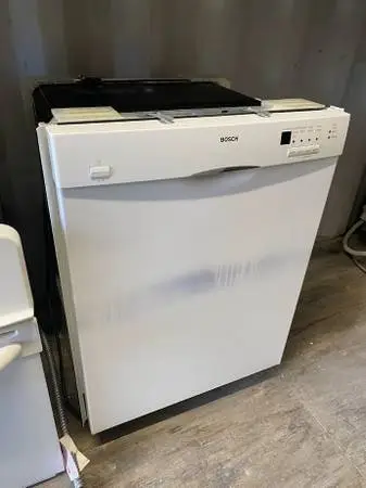 White Bosch Dishwasher SS Interior Model #SHE43F02UC Used