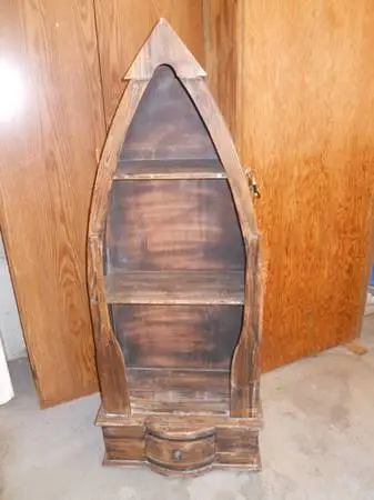 Canoe shaped book case