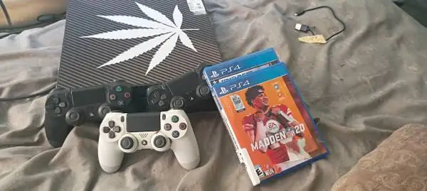 420 PS4 Pro with cords and 3 Controllers and Games