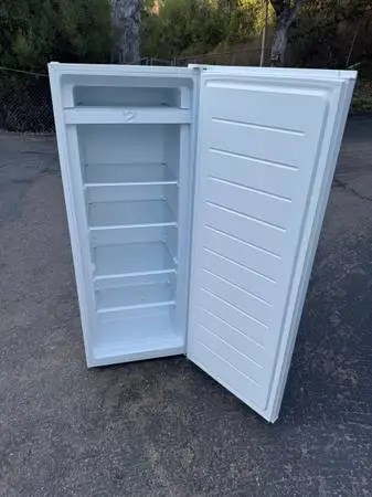 55” high upright freezer (free local delivery)