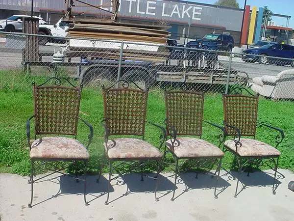 4 metal and wicker arm chairs