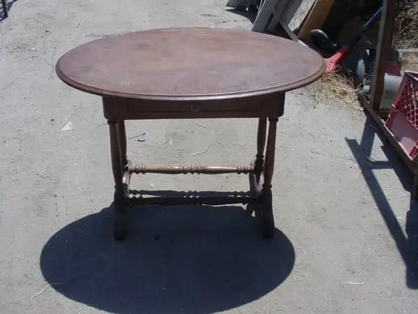 vintage oval table with 1 drawer turnings on legs and spreader