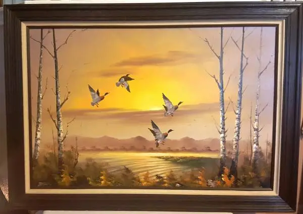 AN OIL painting ON CANVAS DEPICTING DUCKS IN FLIGHT SIGNED K Roche