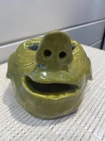 Mid century Modern Abstract Pottery with green glaze Ogre Face