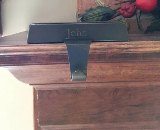 Mantel stocking holder and stocking engraved with John