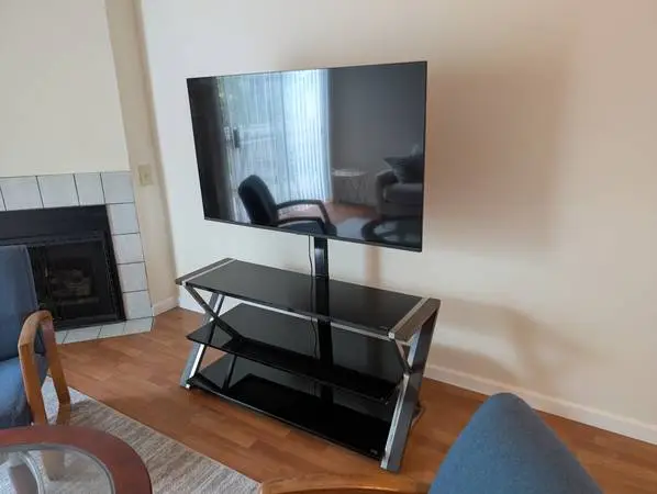 LG 55-Inch UQ7570 Series 4K Smart TV and a stand
