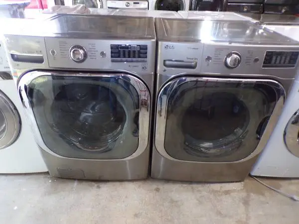 Stainless 5.0 cf LG FRONT LOAD WASHER&DRYER/ pedestals