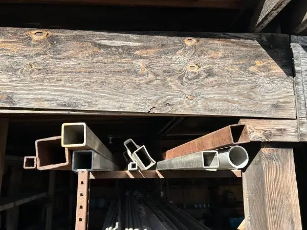(7) pieces of steel square tubing misc size 10-20ft (1) SS tub 20’?