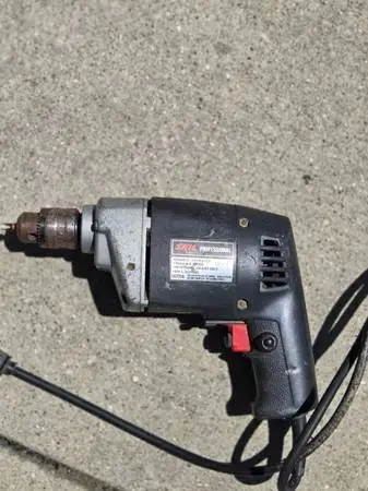 Vintage Skil 597 is a 3/8-inch reversing corded drill