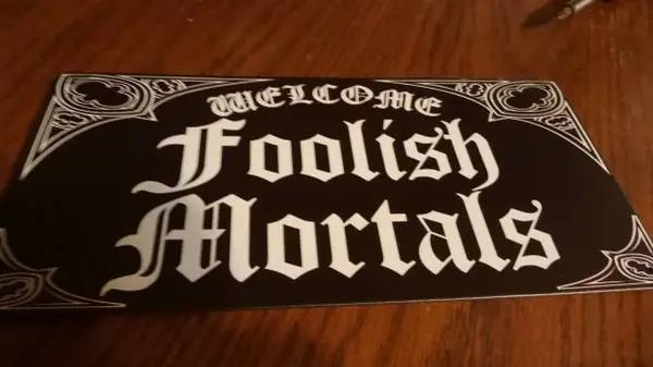 Welcome Foolish Mortals tin sign