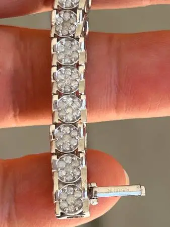 3 CT. T.W. Diamond Round Cluster Tennis Bracelet.