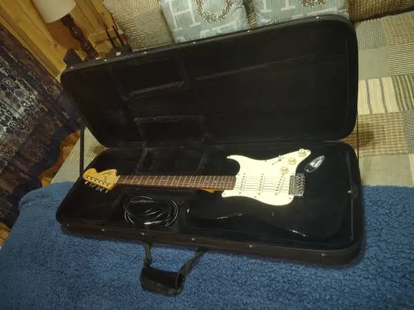Fender Guitar and a 15w Amplifier.