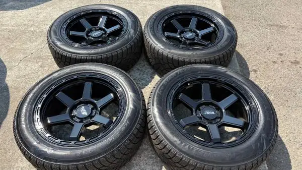 20 INCH BRAND NEW 6 LUG RIMS AND TIRES.