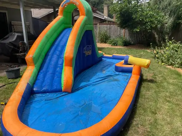 Inflatable pool and water slide