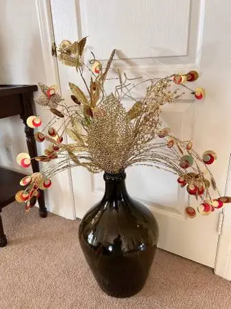 Beautiful glass vase and gold flowers.