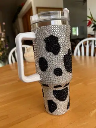 Rhinestone cow print stainless 40oz tumbler.