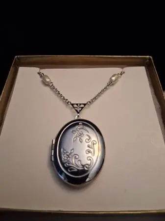 New Vintage Avon Silver Tone Locket