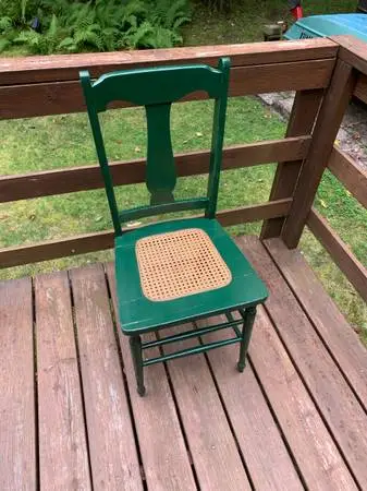 Vintage green chair with cane seat