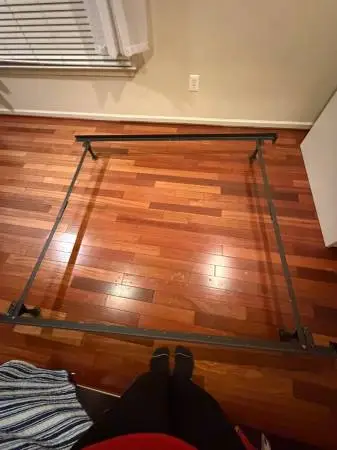 Metal bed frame with clamps