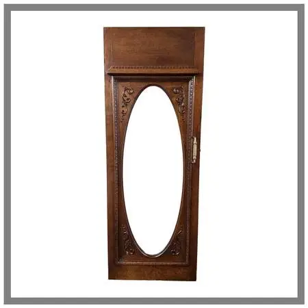 Ornately Carved Wood Door With Beveled Oval Glass