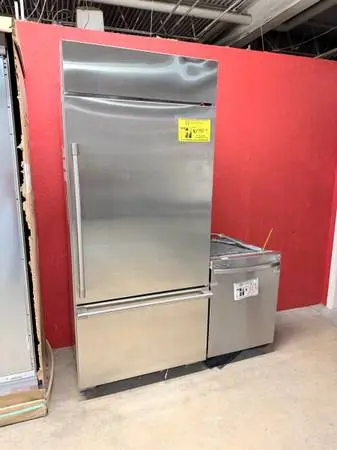 BUILT IN FRIDGE PRE-OWNED, VERY NICE
