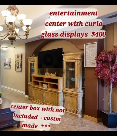 entertainment center with 2 lighted curios