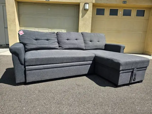 TWO PIECE SECTIONAL COUCH WITH STORAGE AND PULL OUT FOOT REST