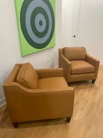 Matching pair of Leather Creations club chairs