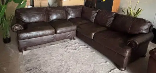 GENUINE LEATHER SECTIONAL BY ASHLEY FURNITURE, DELIVERY INCLUDED