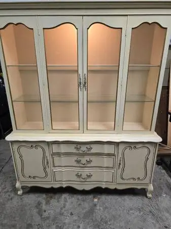 Cabinet with glass front and wood doors and shelves