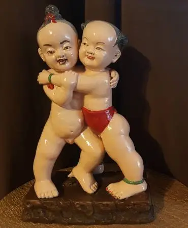 Hand painted Clay Statue of a boy and a girl