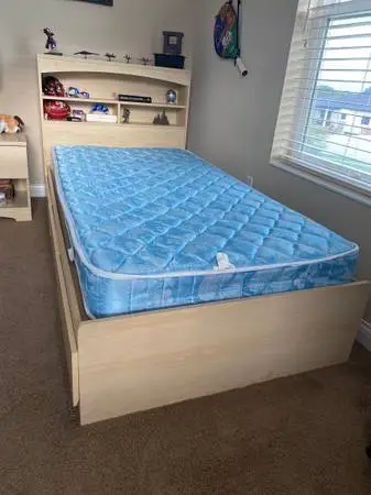 Twin platform bed with storage headboard and drawers for storage