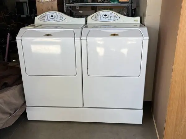 Maytag Neptune washer/dryer set on 8” riser