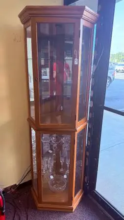 Lighted corner curio cabinet