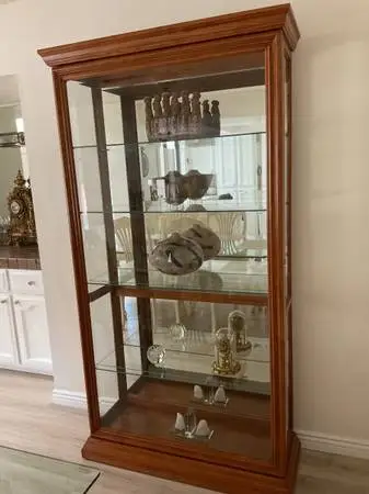 Hutch with thick glass shelves and sliding locking door