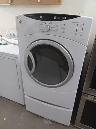 GE White Front Load Electric Dryer On Pedestal