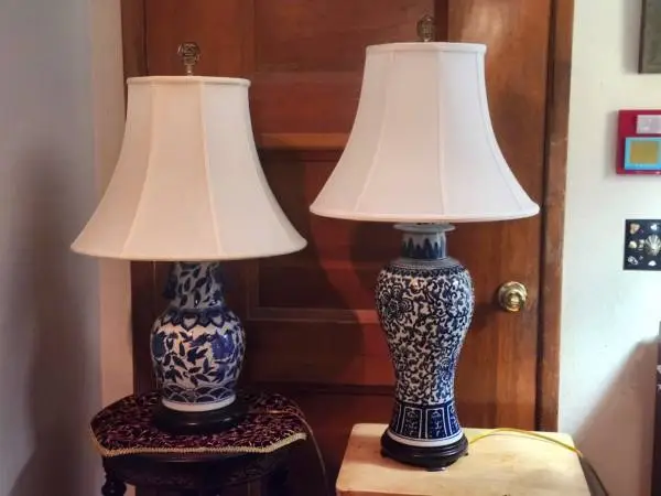 Beautiful pair of oriental styled blue & white lamps. Gold finials.