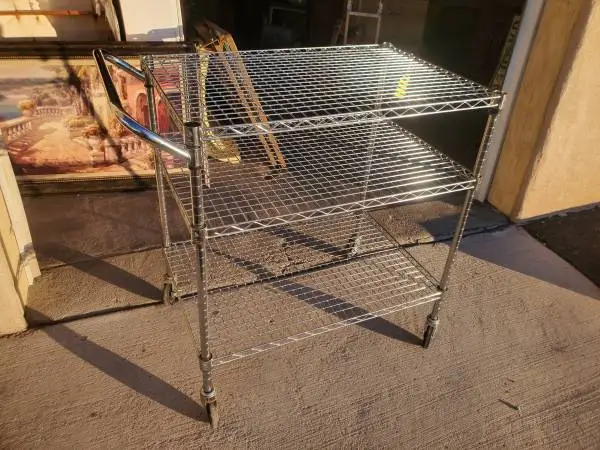 Metal utility cart on wheels