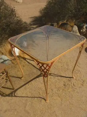 Russell Woodard iron table with glass top...patio furniture