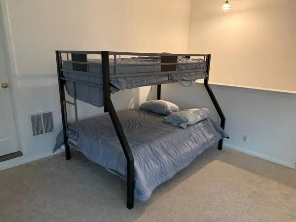 Twin over full bunk bed for sale, includes mattresses and linens