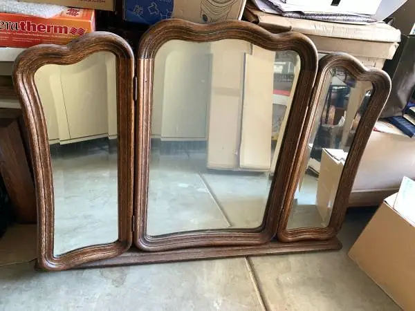 Vintage French Provincial trifold dresser mirror with scalloped crest molding an