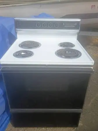 Kenmore electric stove has new trays on it