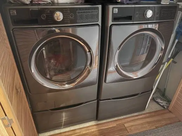 Beautiful Large Front load washer and Electric dryer set on pedestals