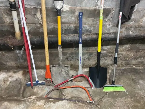 Shovels, 2 sided axe, scrapper/chopper,  brushes, 2- hand tree saws