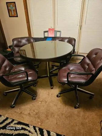 Maghony round table and 4 leather Knoll swivel chairs