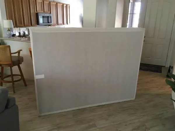 Queen size box spring and bed frame with casters.